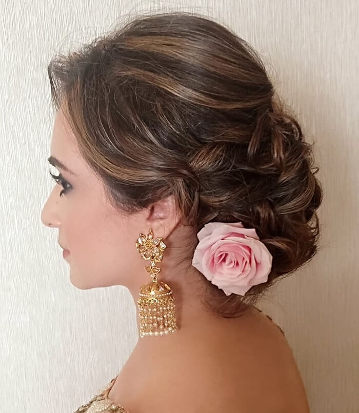 Messy braids with floral accessories Latest hairstyles for Indian brides   Pelli Poola Jada