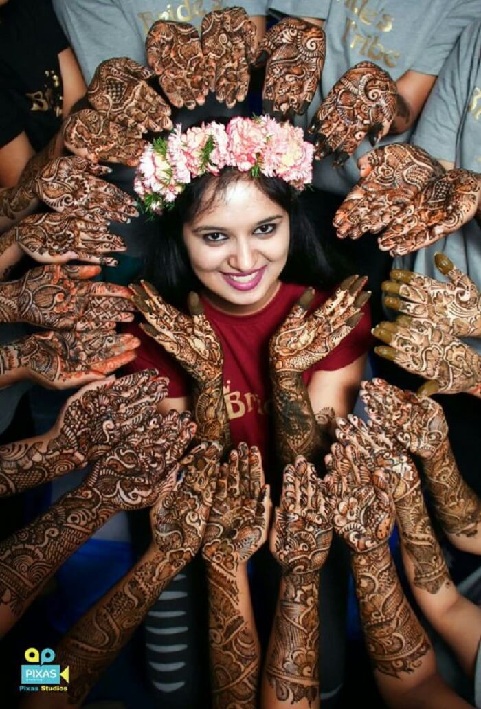 Bride Posing Back Hand Floral Mehndi Design with Diamond Jewellery