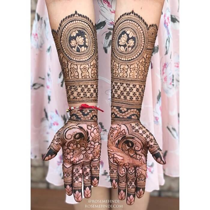 This bridal mehndi design has won many hearts. The flawless symmetry in  both the hands and the intricate lotus design paired with the bri... |  Instagram